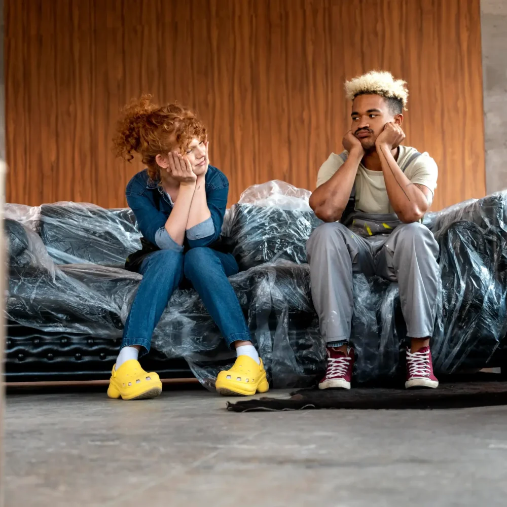 couple-with-cardboard-boxes-their-new-home
